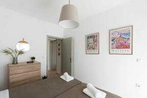 Postel nebo postele na pokoji v ubytování Platon Central Apartment