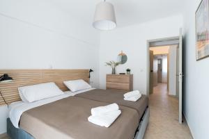 Postel nebo postele na pokoji v ubytování Platon Central Apartment