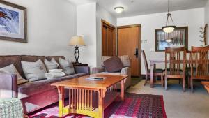 a living room with a couch and a table at Cozy 2BD Near Free Shuttle and Ski Lifts in Dillon