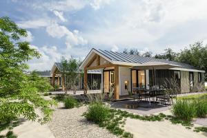 Casa pequeña con patio y mesa en Oysterduinen - Resort Yerseke, en Yerseke