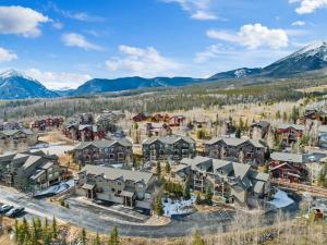 an aerial view of a resort with mountains at 2BR Condo - Ideal Hub for Year-Round Fun in Silverthorne