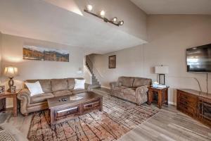 a living room with a couch and a table at 3BD Retreat with Sauna and Free Bus Stop Steps Away in Breckenridge