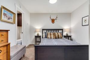 a bedroom with a bed with a spider on the wall at Gorgeous View in Town Walk to Lifts in Breckenridge