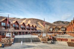 a large building with a mountain in the background at Breathtaking Mountain Views- Ski-in out 2BR Condo in Park City