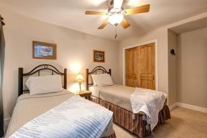 a bedroom with two beds and a ceiling fan at Quaint 2BR Retreat Heart of Town Steps from Lift in Park City