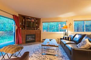 a living room with a couch and a fireplace at Ski in out 2 BDR Condo in the Heart of the Action in Park City