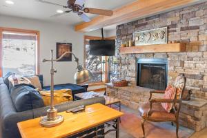 a living room with a couch and a fireplace at 3BR Townhome Incredible Location in Park City