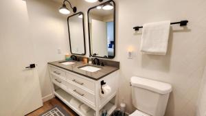 a bathroom with a sink and a mirror at Modern 3BR in Serene Area Near Ski Slopes and Town in Park City +28 photos