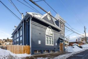a house with a gambrel roof on top of it at Intimate 2BDR in Heart of Town Walk to Ski Lift in Park City
