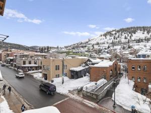 a small town with snow covered buildings on a street at One BDR In Heart of Park City in Park City