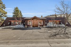a house with a large driveway in front of it at Rustic 2BR Steps from Main St in Park City