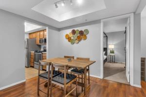 a kitchen and dining room with a table and chairs at 2BR Condo Near Trails and Ski Resorts in Park City