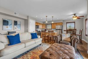 a living room with a white couch and a kitchen at 2BR near Deer Valley East Village in Heber City
