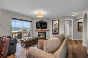 a living room with a couch and a fireplace at 2BR near Deer Valley East Village in Heber City