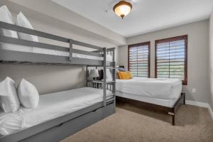 a bedroom with two bunk beds and a window at 2BR near Deer Valley East Village in Heber City +18 photos