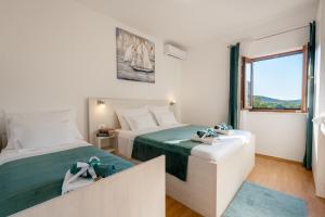 Un pat sau paturi într-o cameră la Villa Ivona