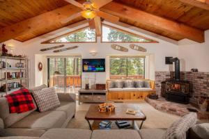 a living room with a couch and a fireplace at The Big Bear Chalet Private Hot Tub in Carnelian Bay