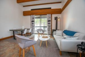 a living room with a white couch and a table at One BDR at Northstar Walk to Village in Truckee