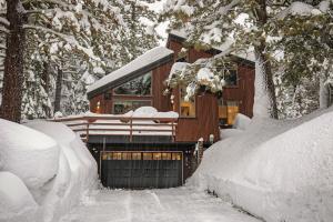 a cabin in the woods with snow on it at North Lake Tahoe Cabin and Hot Tub in Tahoe City
