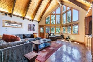 a living room with a couch and a table at EJ's Point Walk to Beach in Tahoe City