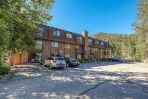 a large building with cars parked in front of it at One BDR in the Heart of Olympic Valley in Alpine Meadows