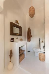 a bathroom with a sink and a toilet at MEDUSA (by labestia collective) in Ahangama