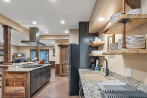 a kitchen with a sink and a refrigerator at 3BD with Hot Tub Two Minutes from King Beach in Tahoe Vista