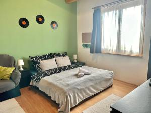 Voodi või voodid majutusasutuse Green Cottage Fonyód toas