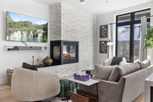a living room with a couch and a fireplace at 2BDR New Build Minutes to Dillon Reservoir in Silverthorne