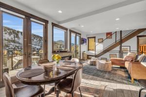 a living room with a table and chairs at 2BD Near Slopes and Town with Impressive Views in Park City