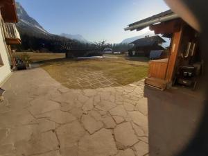 a view of a stone patio with a house at Ferienwohnung für 2 Personen ca 34 qm in Ehrwald, Tirol Gaistal in Ehrwald