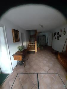 an attic room with a staircase and a table and a desk at Ferienwohnung für 2 Personen ca 34 qm in Ehrwald, Tirol Gaistal in Ehrwald