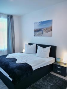 Postel nebo postele na pokoji v ubytování Apartment OTTO II - Erfurt Zentrum