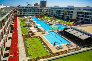 an aerial view of a large swimming pool on a building at Comfy, Luxury Flat for All Ages in Iskele