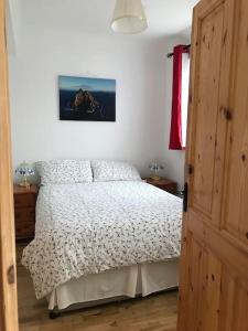 Voodi või voodid majutusasutuse Pier View Portmagee toas
