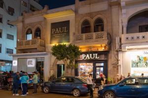 a group of cars parked in front of a store at luxury Heliopolis gem in Cairo