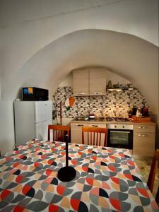 a kitchen with a table with a geometric pattern on it at Apulian Dream in Peschici