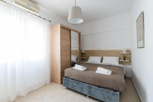 Postel nebo postele na pokoji v ubytování Platon Central Apartment
