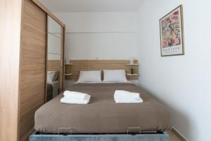 Postel nebo postele na pokoji v ubytování Platon Central Apartment