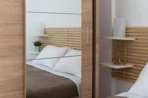 Postel nebo postele na pokoji v ubytování Platon Central Apartment