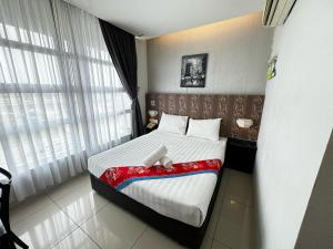Postel nebo postele na pokoji v ubytování Best View Hotel Puchong