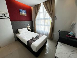 Postel nebo postele na pokoji v ubytování Best View Hotel Puchong