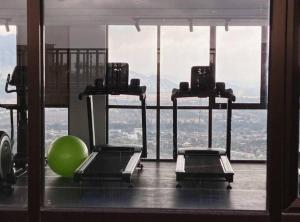 a gym with a green ball and a large window at AYMAR Homestay, Youth City. in Nilai