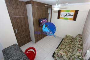 a room with a couch and a chair in a room at Lacqua Diroma Flat - Oficial in Caldas Novas