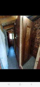 a hallway of a house with a door and a room at Panoramic Bungalow in Uskoci