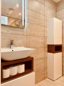 a bathroom with a sink and a mirror at ROBERT HOUSE in London +29 photos