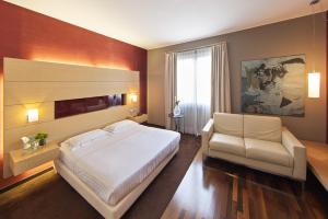 Postel nebo postele na pokoji v ubytování Inverigo Hotel + 37 fotografií