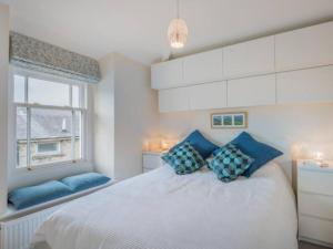 A bed or beds in a room at The Penthouse - in the heart of Sedbergh