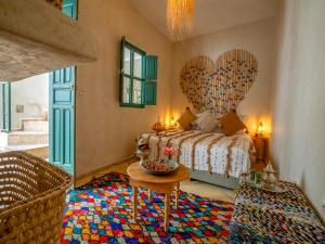 Postel nebo postele na pokoji v ubytování Riad dada Messouda spa