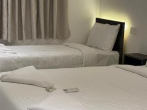 Postel nebo postele na pokoji v ubytování Le Tamara Suite - TIE Hotels & Resorts